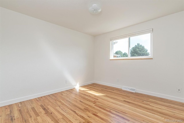 1331 Xanadu St, Aurora, CO 80011 - empty room featuring baseboards and light wood-style floors