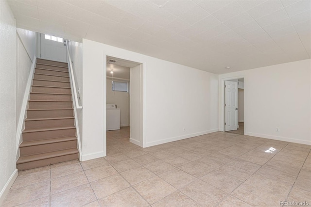 1331 Xanadu St, Aurora, CO 80011 - spare room with washer / dryer, stairway, and light tile patterned flooring