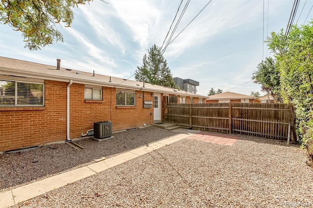 1331 Xanadu St, Aurora, CO 80011 - back of property with brick siding and roof with shingles