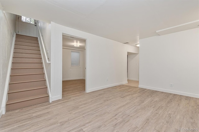 1331 Xanadu St, Aurora, CO 80011 - unfurnished living room with wood finished floors and stairs