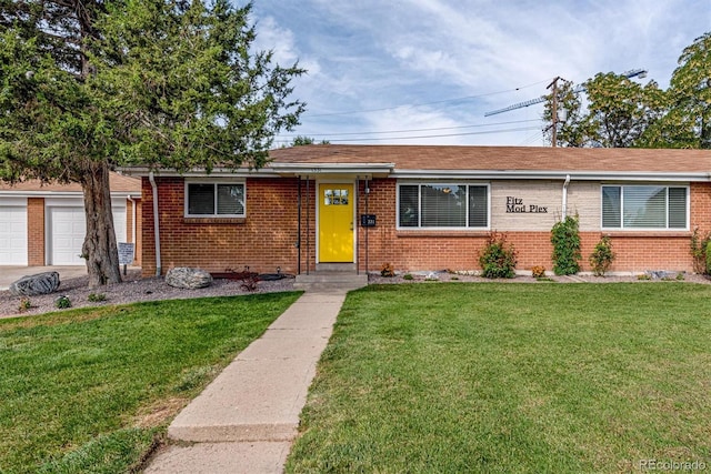 1331 Xanadu St, Aurora, CO 80011 - view of front of house featuring brick siding and a front yard