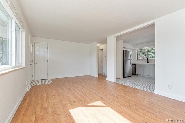 1331 Xanadu St, Aurora, CO 80011 - unfurnished room featuring light wood finished floors and baseboards