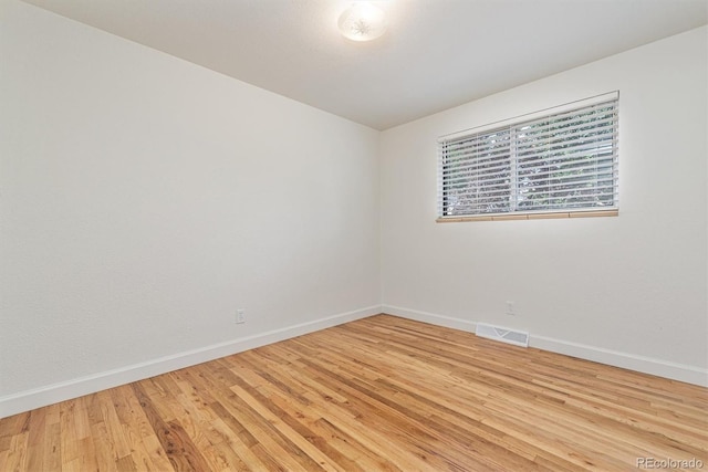 1331 Xanadu St, Aurora, CO 80011 - spare room featuring baseboards and light wood finished floors