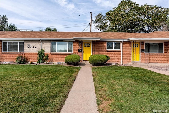 1331 Xanadu St, Aurora, CO 80011 - single story home with brick siding and a front yard