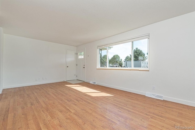 1331 Xanadu St, Aurora, CO 80011 - unfurnished room with light wood-type flooring