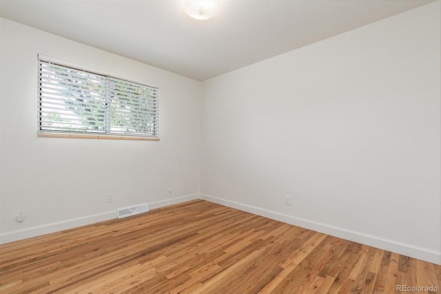 1331 Xanadu St, Aurora, CO 80011 - spare room with baseboards and light wood-style floors