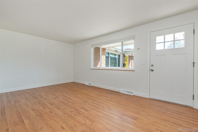 1331 Xanadu St, Aurora, CO 80011 - entrance foyer featuring light wood finished floors and baseboards