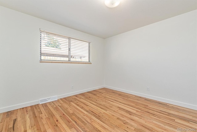 1331 Xanadu St, Aurora, CO 80011 - unfurnished room with baseboards and light wood-type flooring