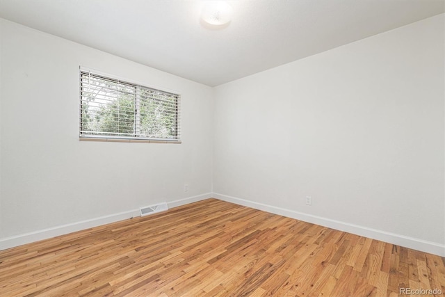 1331 Xanadu St, Aurora, CO 80011 - spare room featuring baseboards and light wood-style floors