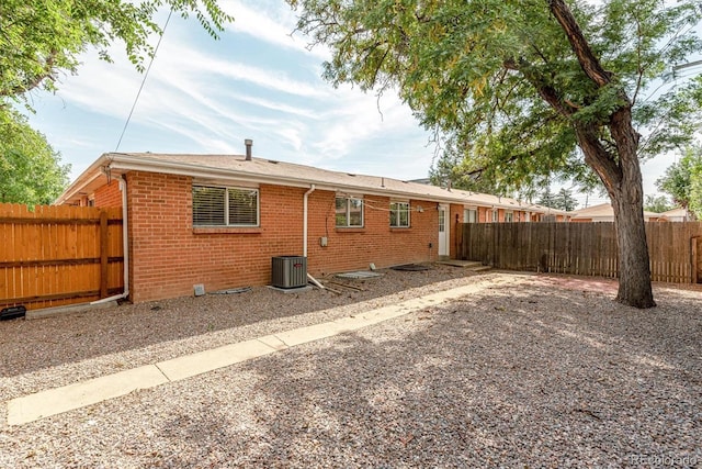 1331 Xanadu St, Aurora, CO 80011 - rear view of property featuring brick siding and a fenced backyard