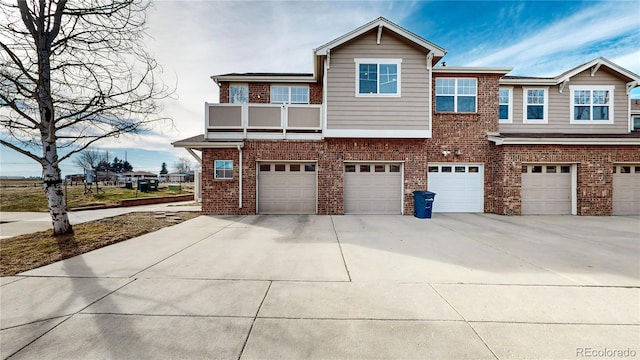 view of front of property with a garage and a balcony