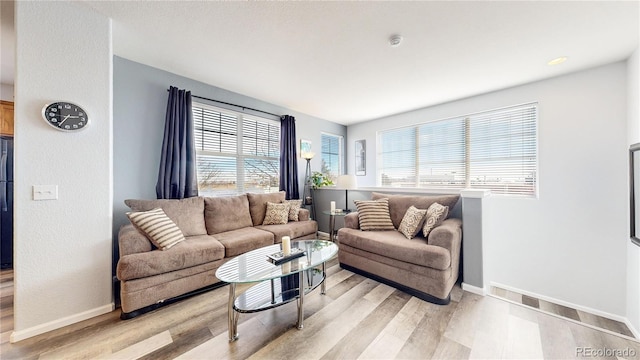 living room with light hardwood / wood-style floors