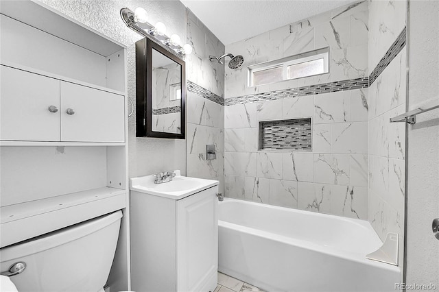 full bathroom with vanity, a textured ceiling, tiled shower / bath combo, and toilet