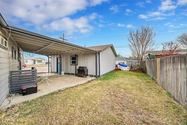 back of property featuring a patio area and a lawn