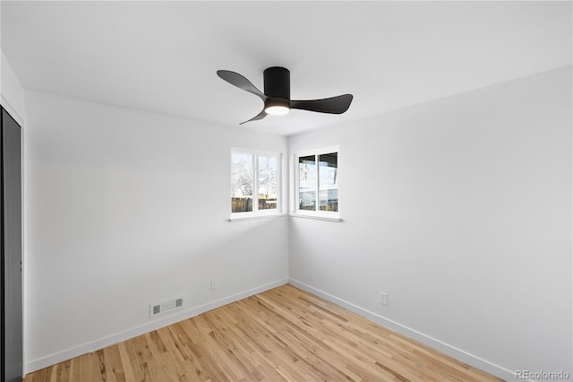 spare room with ceiling fan and light hardwood / wood-style flooring