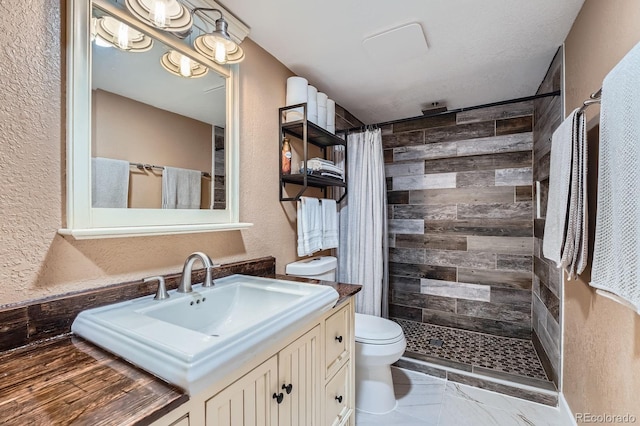 2286 S Pitkin Way Unit A, Aurora, CO 80013 - full bathroom featuring a textured wall, vanity, and tiled shower