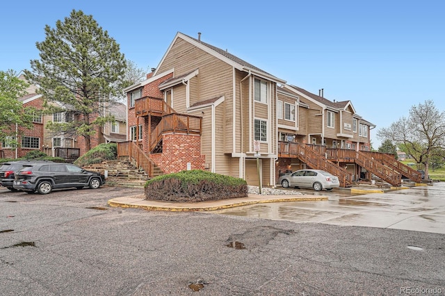 2286 S Pitkin Way Unit A, Aurora, CO 80013 - view of building exterior featuring stairs and uncovered parking