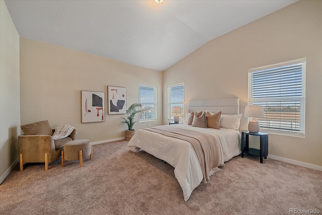 carpeted bedroom featuring multiple windows and vaulted ceiling