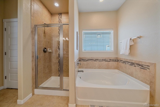 bathroom featuring tile patterned floors and plus walk in shower