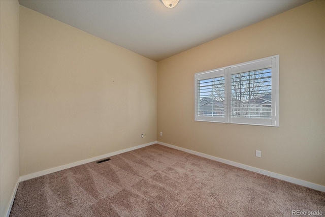 unfurnished room with carpet flooring