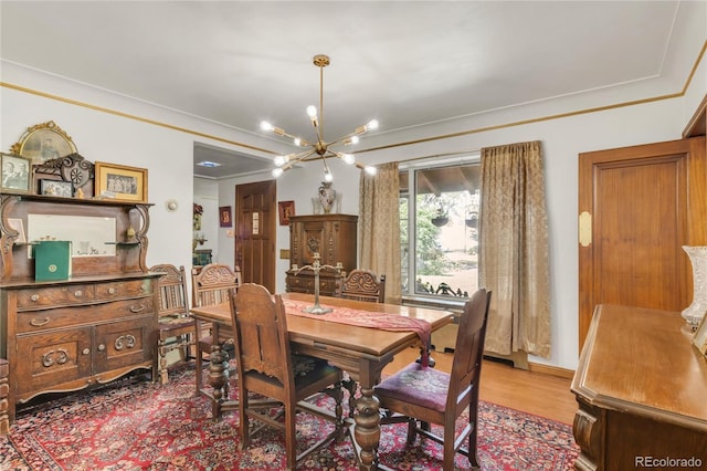 1475 S Monaco St Parkway, Denver, CO 80224 - dining space with a chandelier, crown molding, and wood finished floors