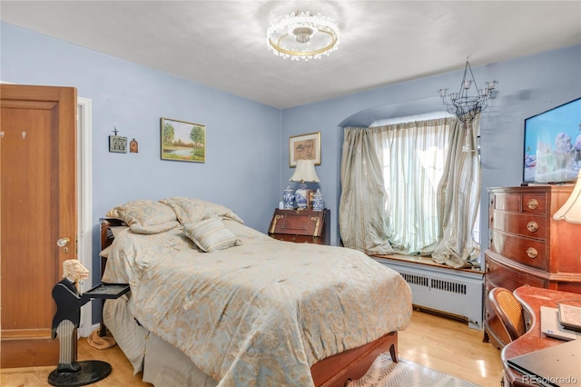 1475 S Monaco St Parkway, Denver, CO 80224 - bedroom with radiator and wood finished floors