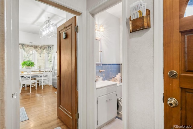 1475 S Monaco St Parkway, Denver, CO 80224 - hallway with light wood-style floors