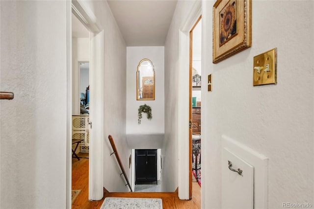 1475 S Monaco St Parkway, Denver, CO 80224 - hall with an upstairs landing, wood finished floors, and a textured wall