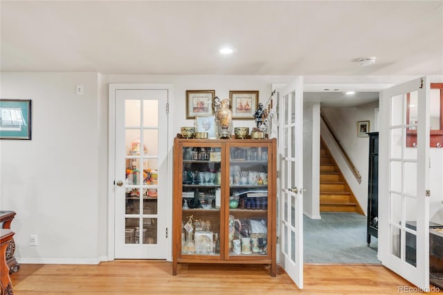 1475 S Monaco St Parkway, Denver, CO 80224 - unfurnished dining area featuring wood finished floors, stairway, and recessed lighting