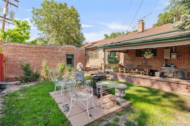 1475 S Monaco St Parkway, Denver, CO 80224 - view of green lawn featuring a patio
