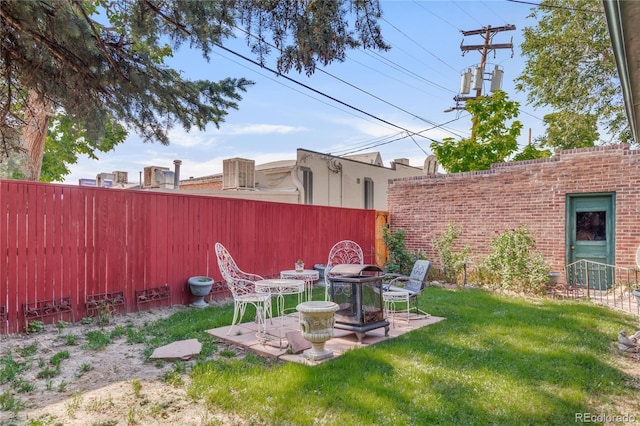 1475 S Monaco St Parkway, Denver, CO 80224 - fenced backyard with a patio area