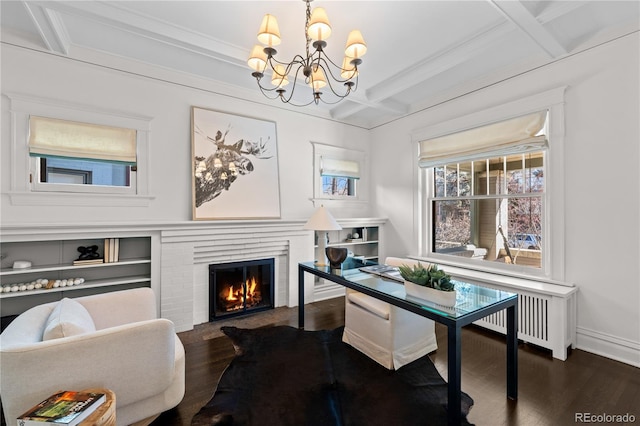 office area featuring dark wood-style flooring, a fireplace, coffered ceiling, beamed ceiling, and baseboards