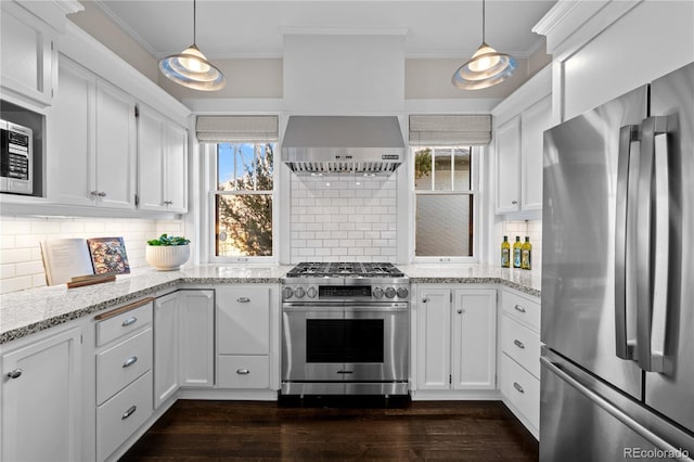 kitchen featuring dark wood-style flooring, crown molding, appliances with stainless steel finishes, white cabinets, and wall chimney exhaust hood