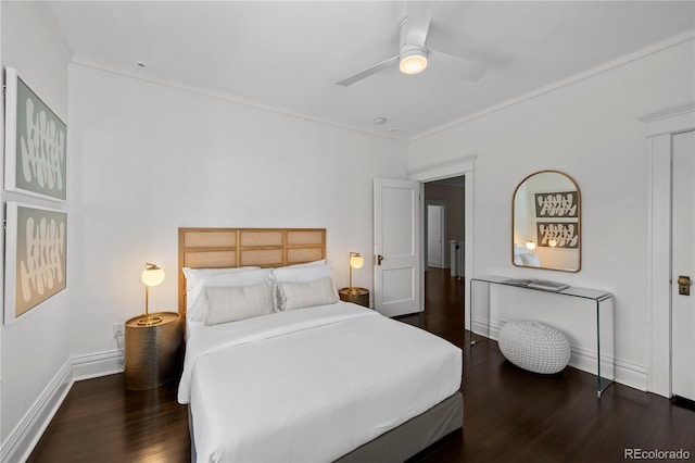 bedroom featuring crown molding, wood finished floors, a ceiling fan, and baseboards