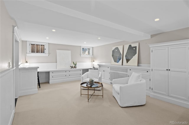 living room with recessed lighting and light colored carpet
