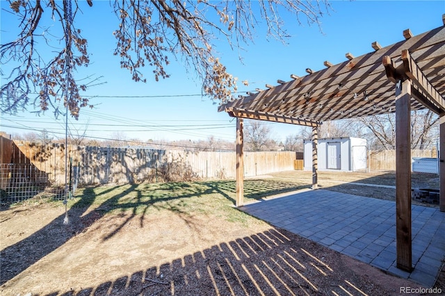 view of patio featuring a storage unit and a pergola