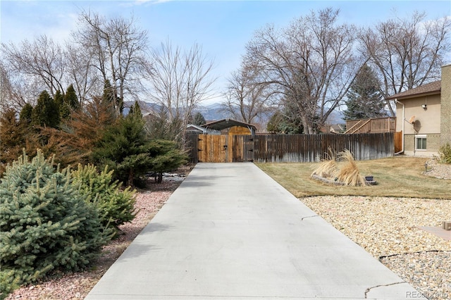 exterior space featuring fence and a gate