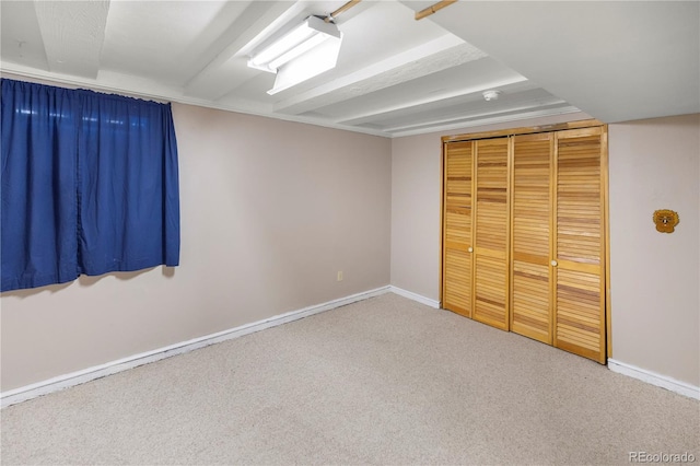 unfurnished bedroom with baseboards and carpet floors