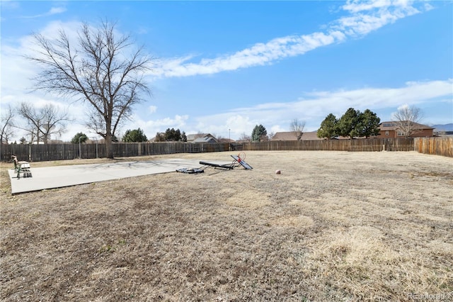 view of yard featuring a patio and a fenced backyard