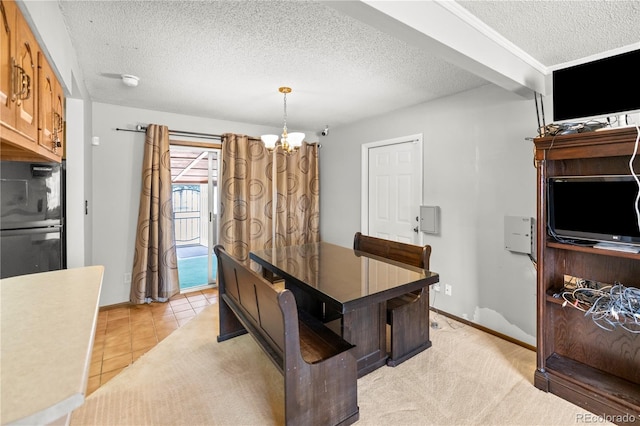 dining area featuring baseboards, a notable chandelier, light tile patterned flooring, and a textured ceiling