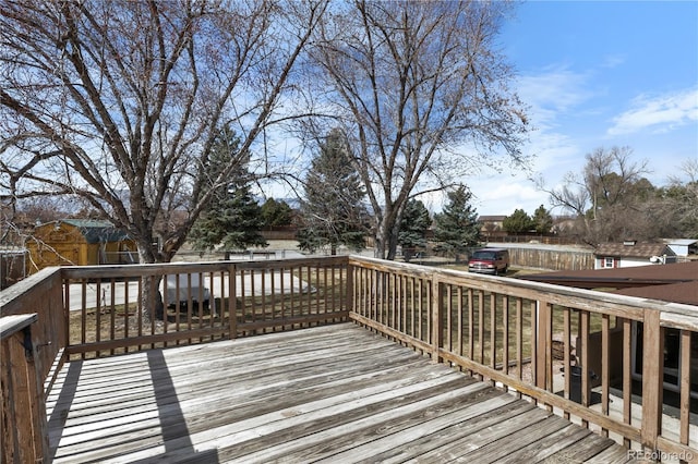 wooden deck featuring fence