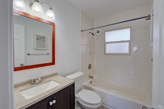 bathroom featuring toilet, tub / shower combination, and vanity