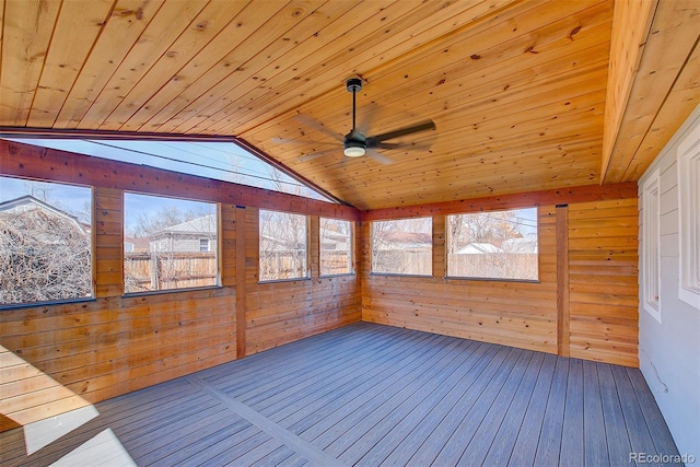 unfurnished sunroom featuring wood ceiling, a ceiling fan, and vaulted ceiling