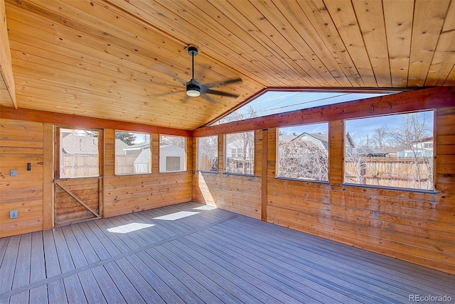 unfurnished sunroom with a healthy amount of sunlight, wooden ceiling, and lofted ceiling