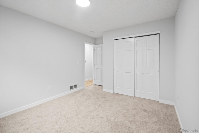 2090 S Fairplay St, Aurora, CO 80014 - unfurnished bedroom featuring carpet floors, baseboards, and a closet