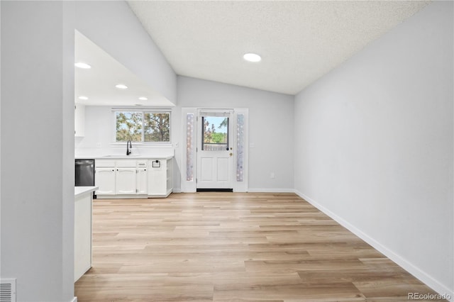 2090 S Fairplay St, Aurora, CO 80014 - entrance foyer featuring recessed lighting, light wood-style flooring, vaulted ceiling, a textured ceiling, and baseboards
