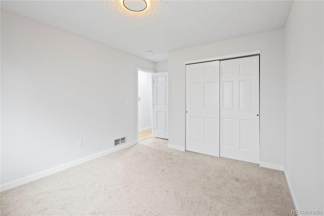 2090 S Fairplay St, Aurora, CO 80014 - unfurnished bedroom with carpet floors, baseboards, a closet, and a textured ceiling