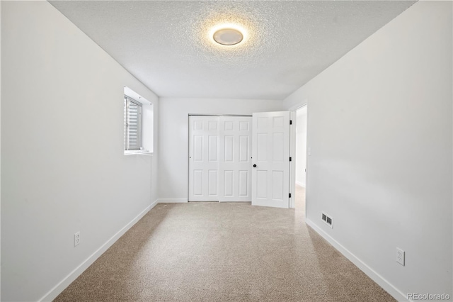 2090 S Fairplay St, Aurora, CO 80014 - unfurnished bedroom featuring a textured ceiling, baseboards, carpet floors, and a closet