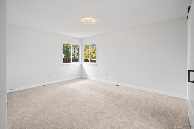 2090 S Fairplay St, Aurora, CO 80014 - carpeted spare room featuring baseboards and a textured ceiling