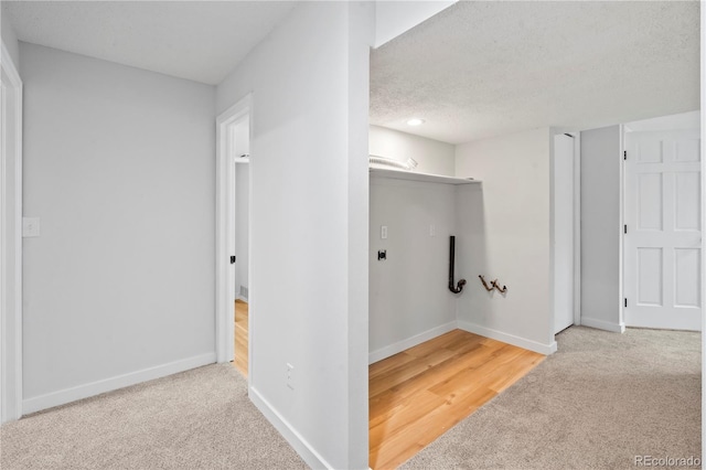 2090 S Fairplay St, Aurora, CO 80014 - hall with carpet floors, baseboards, and a textured ceiling